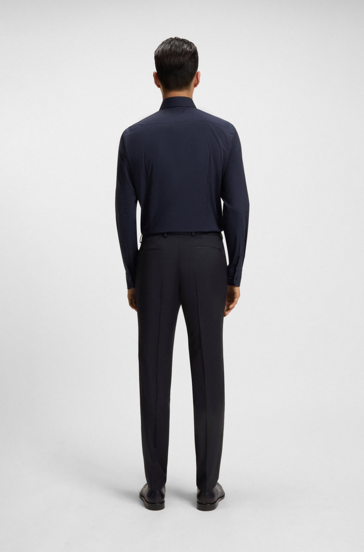 Pantaloni a vestibilità extra slim in sarga di lana vergine