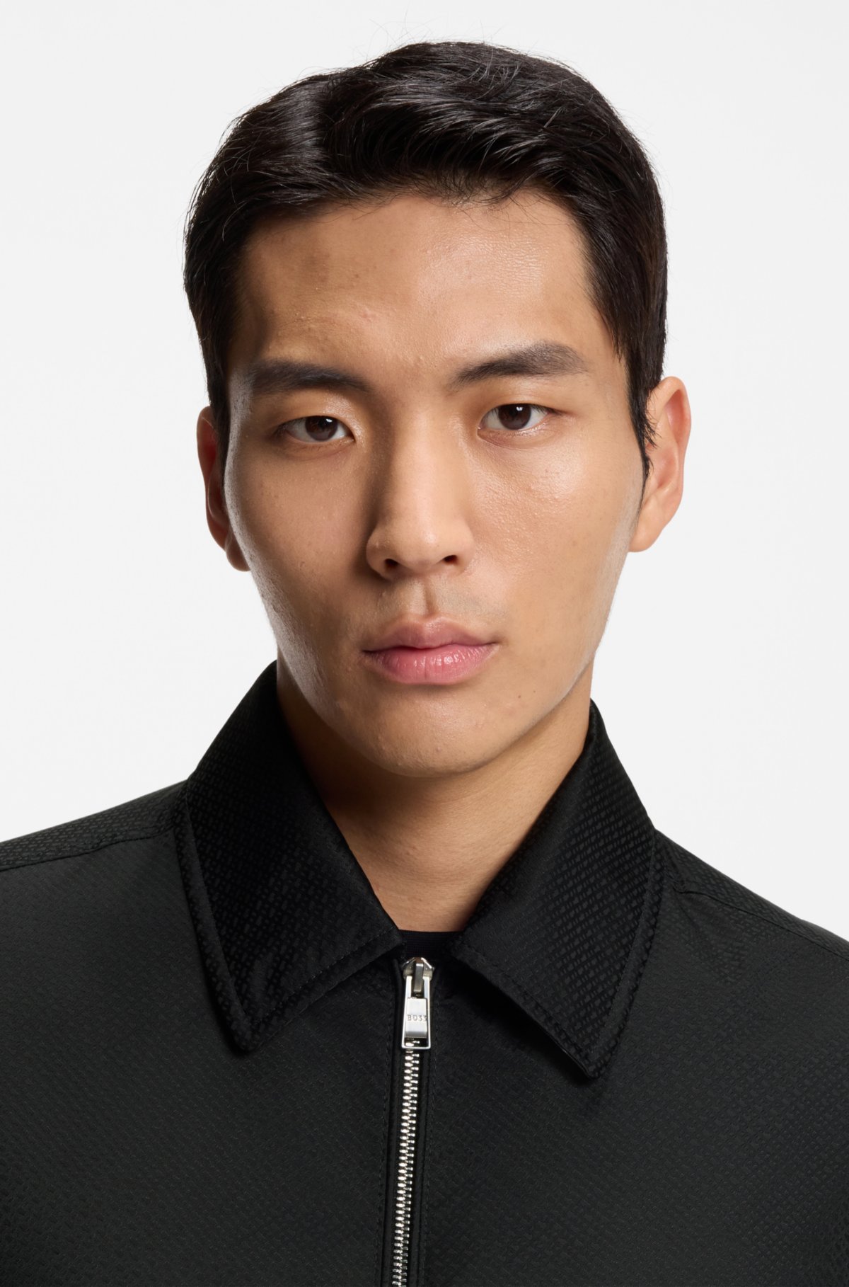 Giubbotto con micro-monogramma e finitura idrorepellente