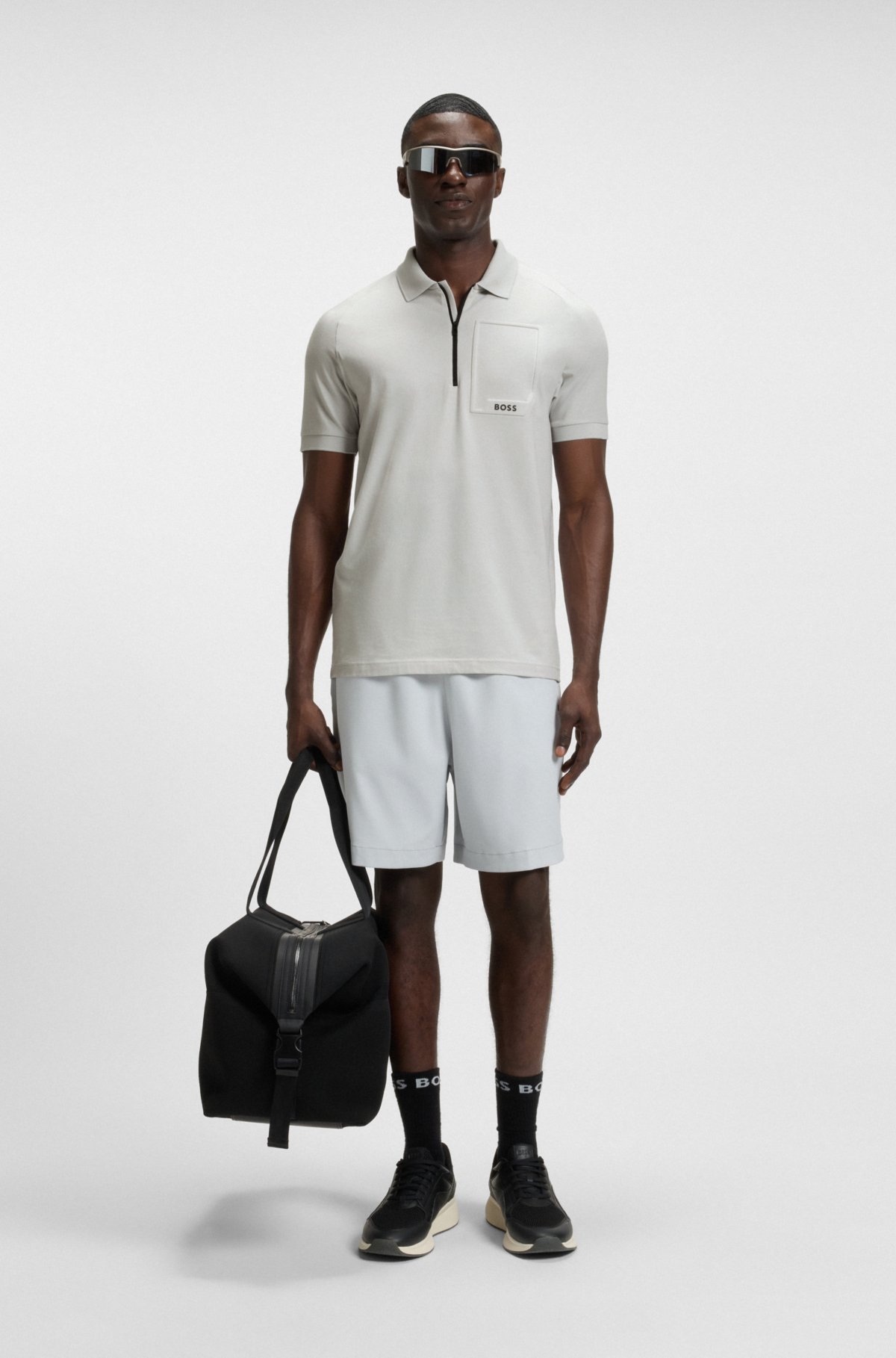 Maglia polo con collo a zip in tessuto che allontana il sudore