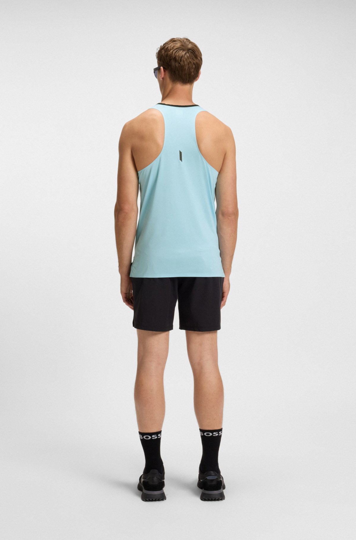 Top in maglia in tessuto tecnico con dettagli riflettenti decorativi