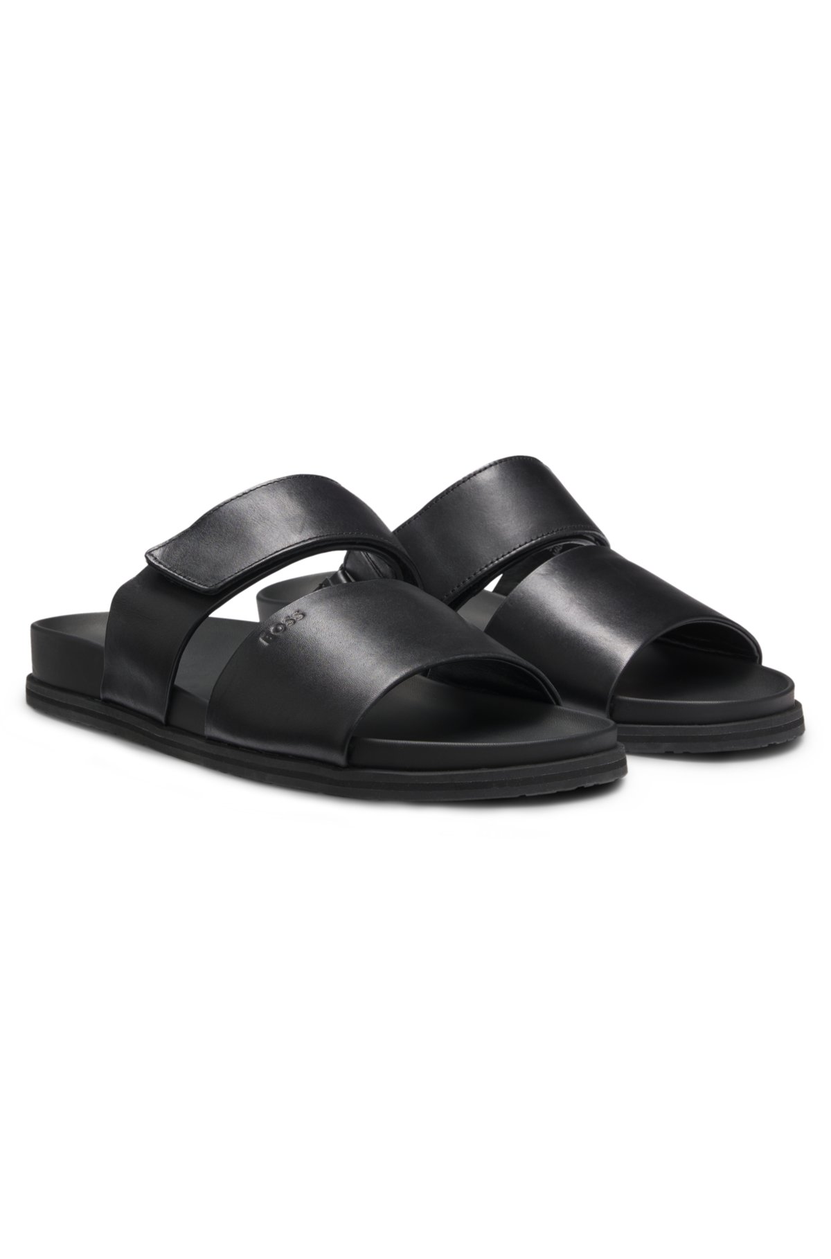 Pantofole in pelle con cinturino a rullo